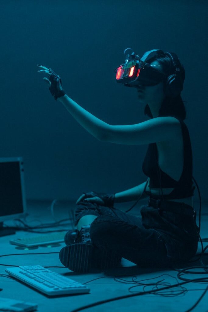 Woman immersed in virtual reality, surrounded by tech, in a dimly lit room.